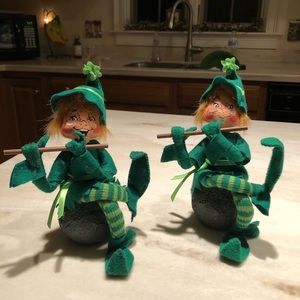 Pair of musical leprechauns sitting on the “blarney” stone.